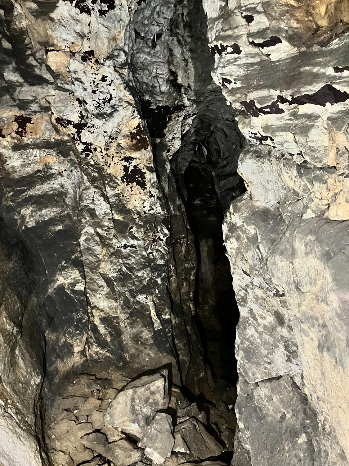 Narrow rocky passage inside a mine.